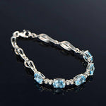 Sterling Silver Blue Topaz Charm BraceletBracelet