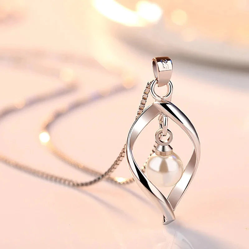 Gyrate Pearl Pendants And Necklaces