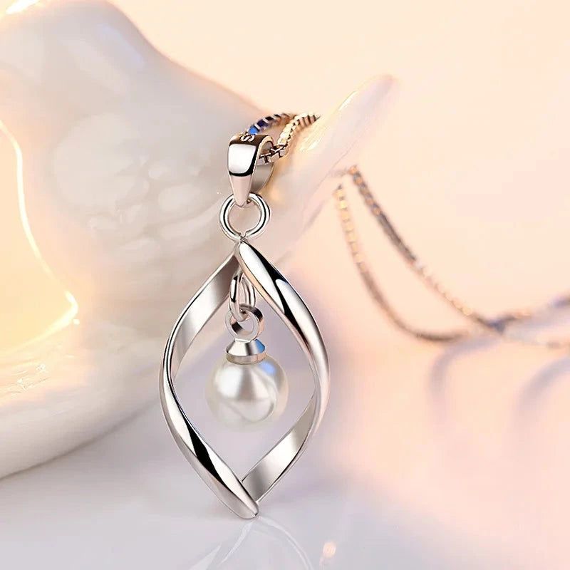 Gyrate Pearl Pendants And Necklaces
