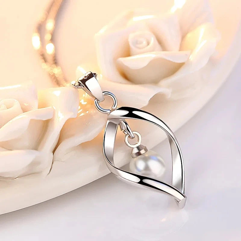 Gyrate Pearl Pendants And Necklaces