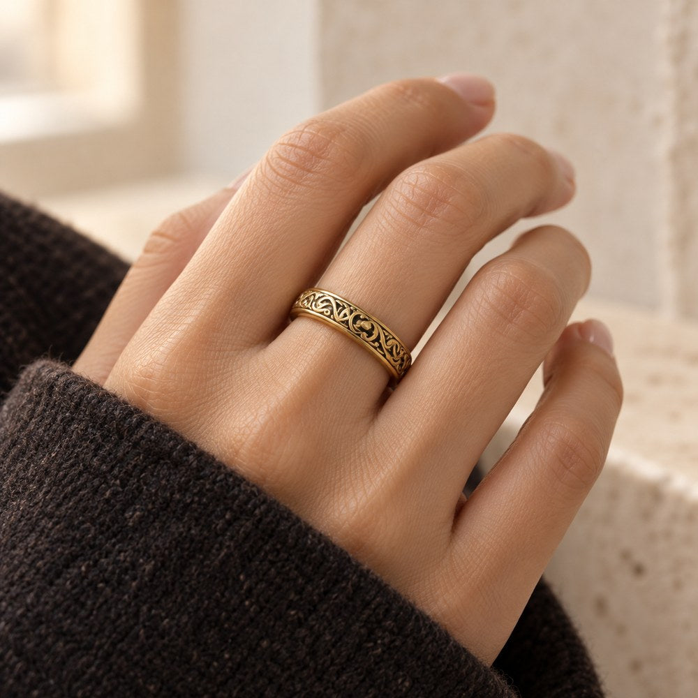 Astronomical Sphere Ring in gold-tone, closed and worn on a woman's finger