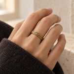 Astronomical Sphere Ring in gold-tone, closed and worn on a woman's finger