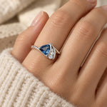 Blue Wave Triangle Ring worn on a woman's finger