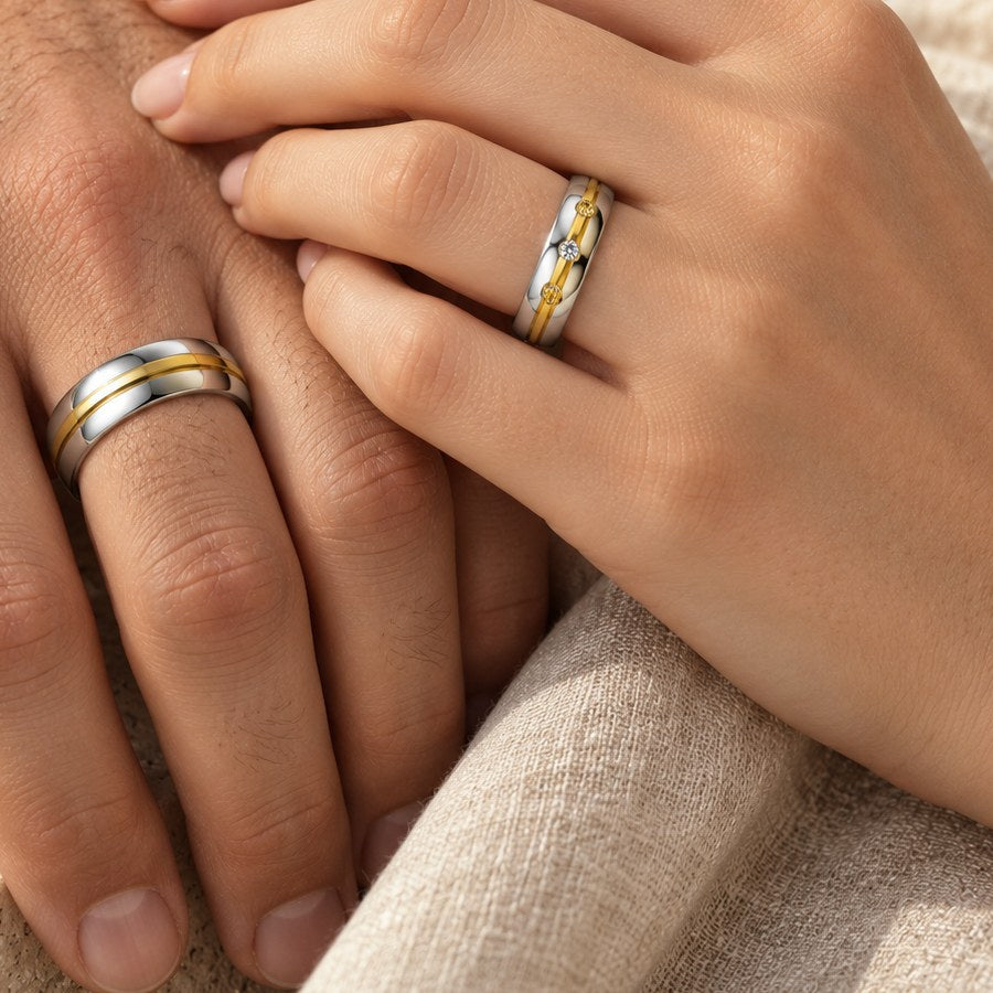 His and hers promise rings with a gold-tone stripe, worn on two hands
