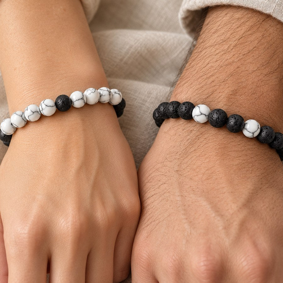 White howlite and black lava couples bracelets worn on two wrists