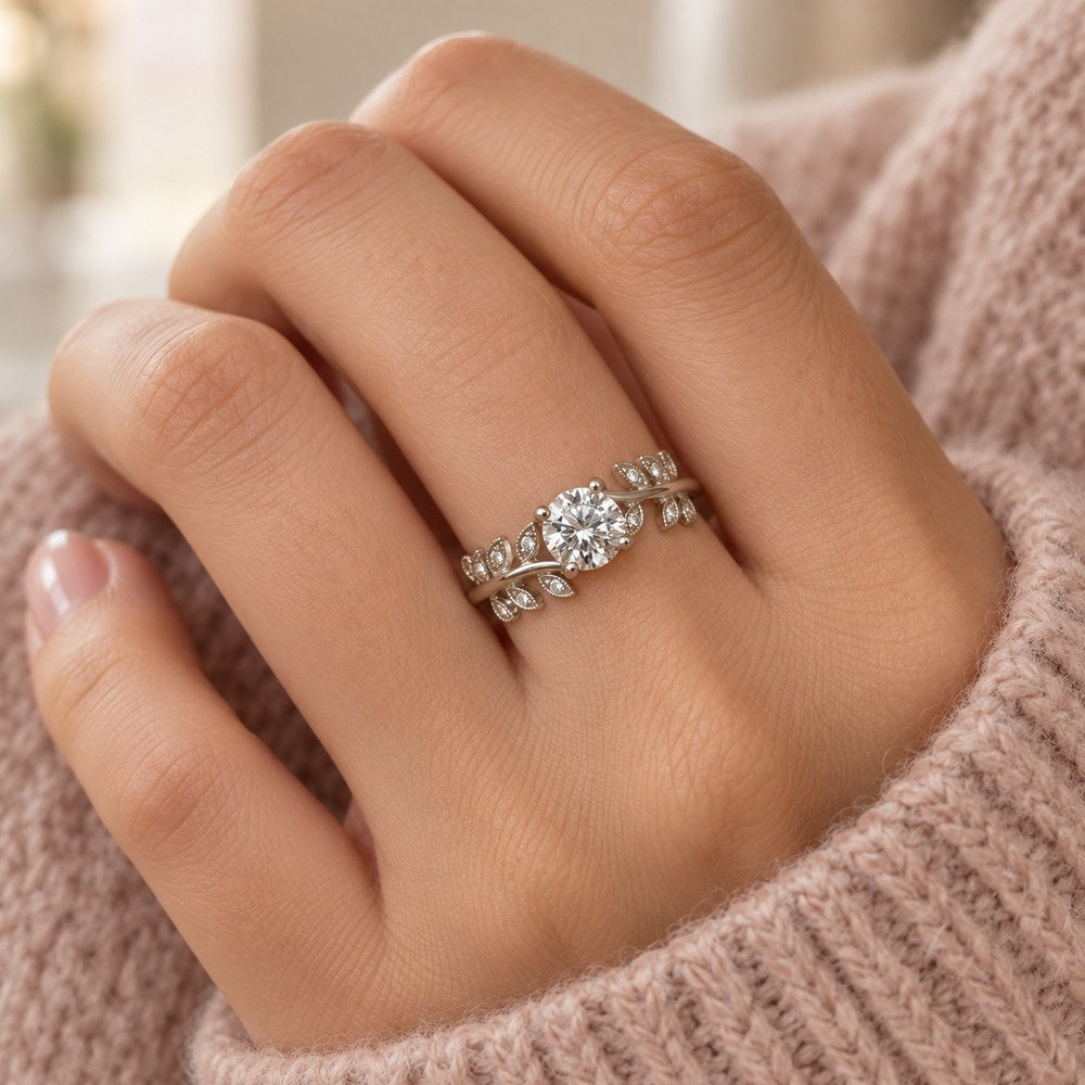 Moissanite leaf vine ring in sterling silver, worn on a woman's finger