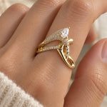Marquise Crossover Ring in gold-tone, worn on a woman's finger