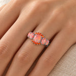Orange Fire Opal Garnet Ring worn on a woman's finger
