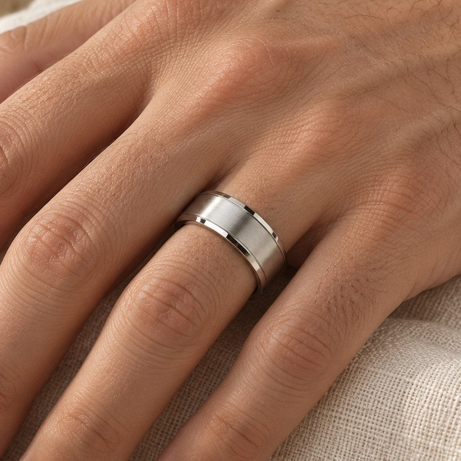8 mm brushed stainless steel band worn on a man's ring finger