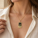 The Star tarot card necklace worn just below a woman's collarbone