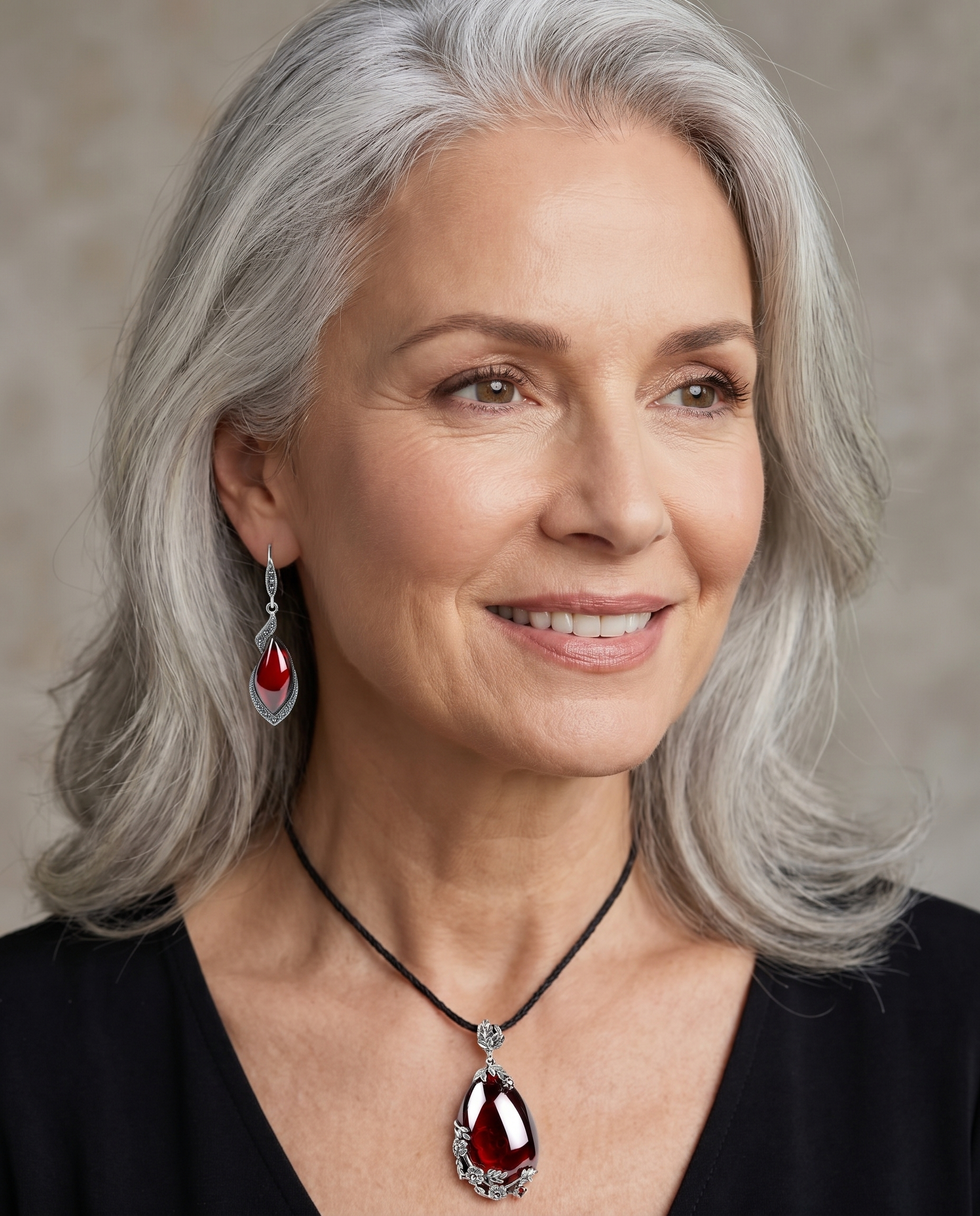 Elegant woman wearing the Garnet Pendant & Earrings Set - AtPerry's