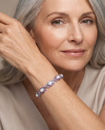 Elegant woman wearing the Fire Opal & Amethyst Bracelet - AtPerry's