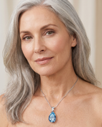 Elegant woman wearing the Aquamarine Pendant - AtPerry's