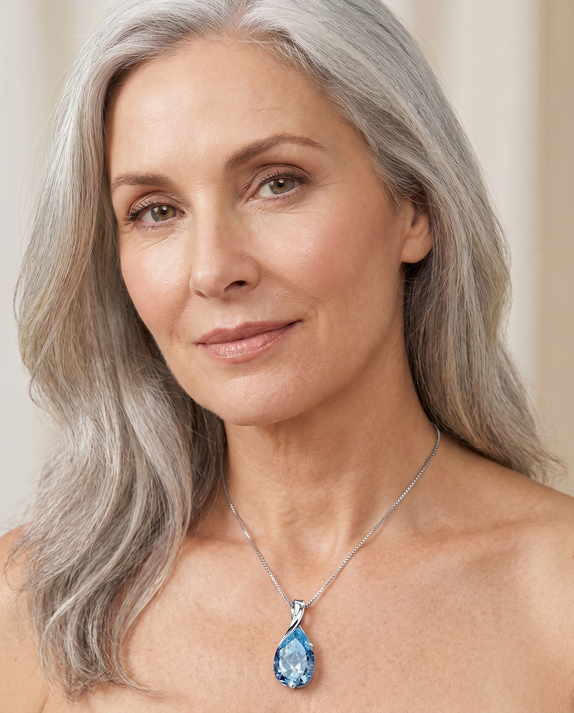Elegant woman wearing the Aquamarine Pendant - AtPerry's